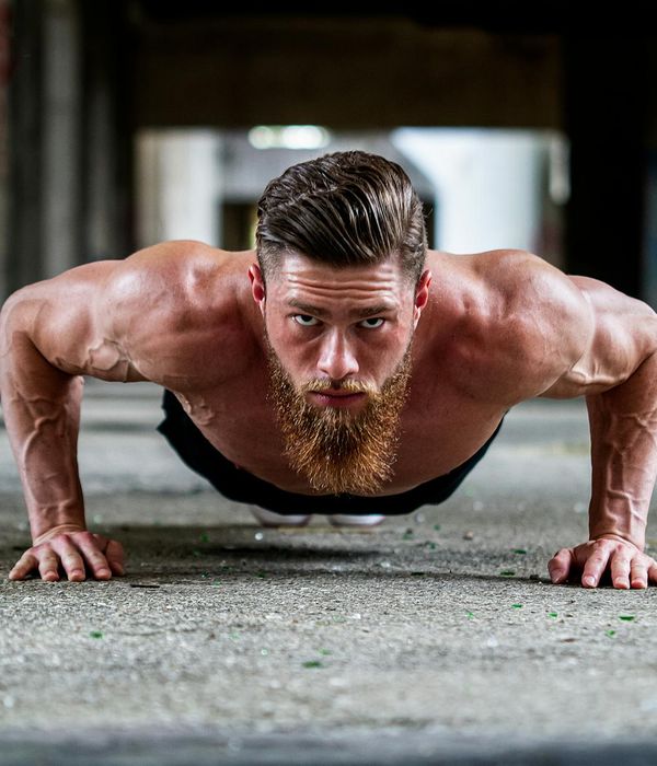 Man in a state of focus during a floor exercise.